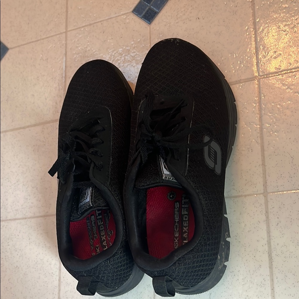 Skechers Black Sneakers with Mesh Upper and Sporty Design